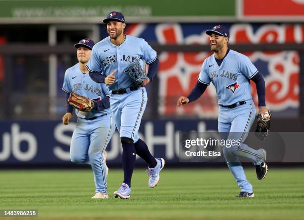 Daulton Varsho,Kevin Kiermaier and George Springer of the Toronto Blue Jays celebrate the win over the New York Yankees at Yankee Stadium on April...