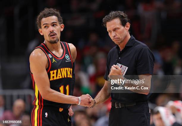 Head coach Quin Snyder of the Atlanta Hawks reacts with Trae Young against the Boston Celtics during the fourth quarter of Game Three of the Eastern...