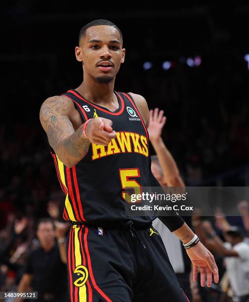 Dejounte Murray of the Atlanta Hawks reacts towards Derrick White of the Boston Celtics after hitting a three-point basket during the fourth quarter...