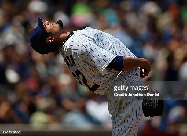 Starting pitcher Matt Garza of the Chicago Cubs stretches before throwing against the Arizona Diamondbacks at Wrigley Field on July 15, 2012 in...