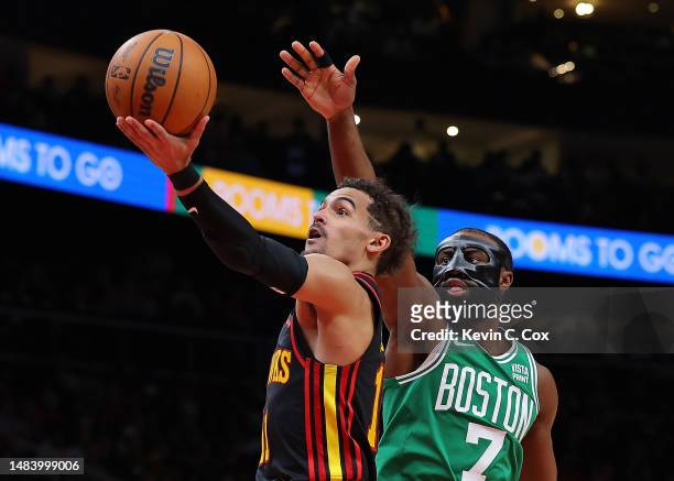 Trae Young of the Atlanta Hawks drives against Jaylen Brown of the Boston Celtics during the fourth quarter of Game Three of the Eastern Conference...