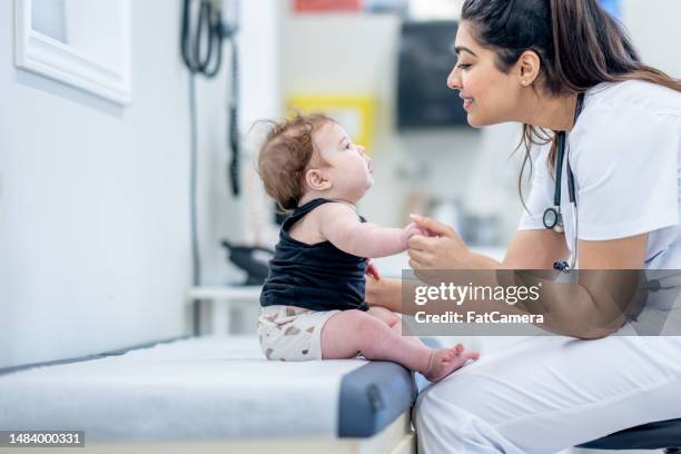 infant at the doctors - nurse with baby stock pictures, royalty-free photos & images