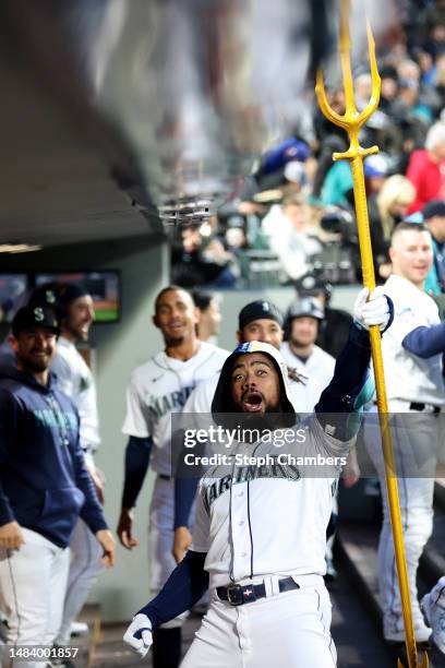 Teoscar Hernandez of the Seattle Mariners celebrates his home run with the celebration trident during the fourth inning against the St. Louis...