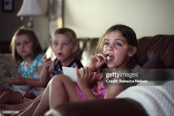 movie night - boy watching tv stock pictures, royalty-free photos & images