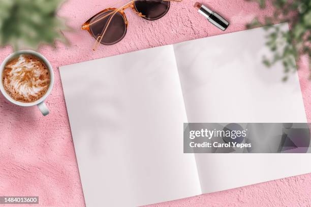 blank magazine page  in pink concrete surface.blogger - magazine mockup stock-fotos und bilder