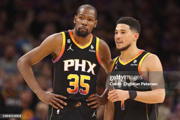 Kevin Durant and Devin Booker of the Phoenix Suns during the second half of Game Two of the Western Conference First Round Playoffs at Footprint...