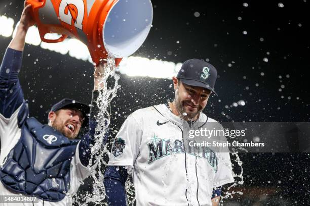 Tom Murphy douses AJ Pollock of the Seattle Mariners with water after beating the St. Louis Cardinals 5-2 at T-Mobile Park on April 21, 2023 in...