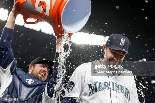 Tom Murphy douses AJ Pollock of the Seattle Mariners with water after beating the St. Louis Cardinals 5-2 at T-Mobile Park on April 21, 2023 in...