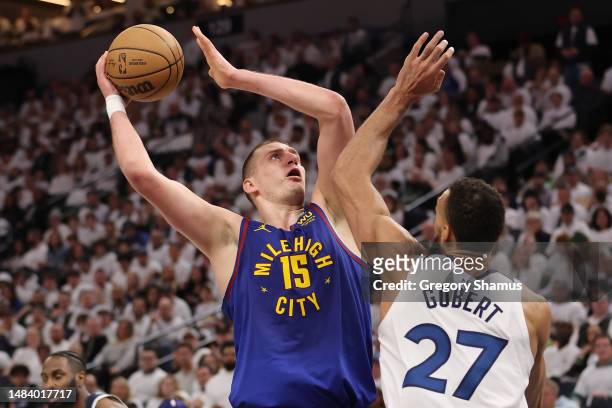 Nikola Jokic of the Denver Nuggets takes a second half shot over Rudy Gobert of the Minnesota Timberwolves during Game Three of the Western...