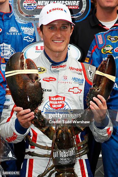 Kasey Kahne, driver of the Farmers Insurance Chevrolet, celebrates in Victory Lane after winning the NASCAR Sprint Cup Series LENOX Industrial Tools...