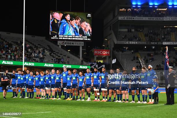 The Blues stand in honour of ANZAC ahead of the round nine Super Rugby Pacific match between Blues and NSW Waratahs at Eden Park, on April 22 in...