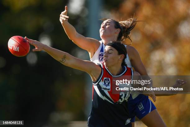 Jessica Jones of North Melbourne and Shannon Egan of the Falcons contest the ruck during the round five VFLW match between Darebin Falcons and North...