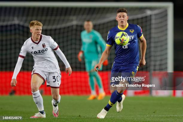 Adolfo Gaich of Verona and Jerdy Schouten of Bologna during the Serie A match between Hellas Verona and Bologna FC at Stadio Marcantonio Bentegodi on...