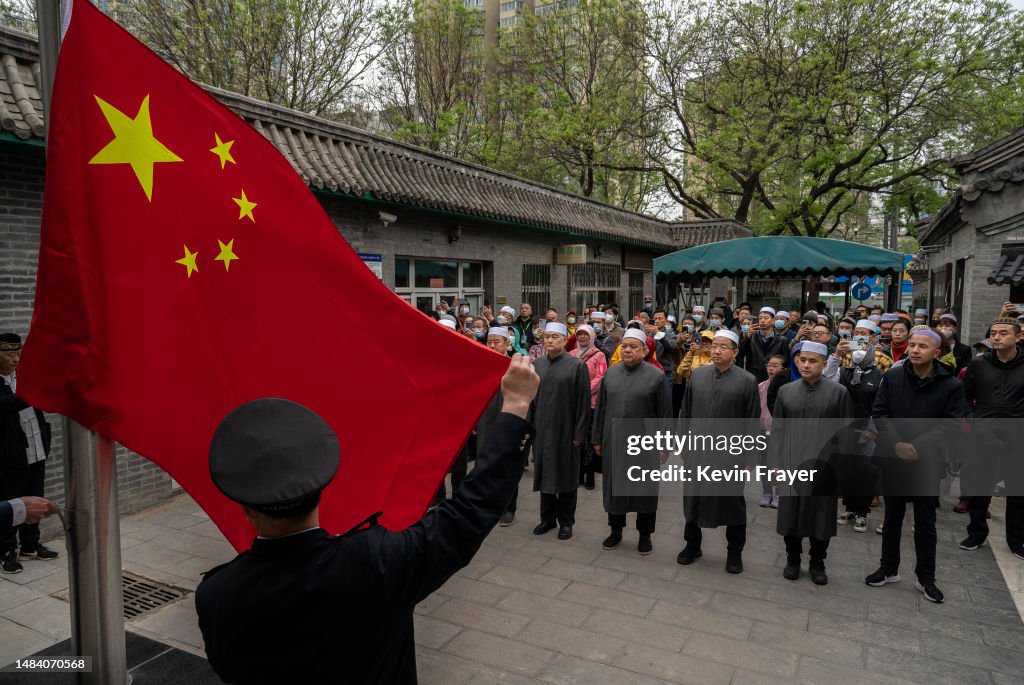 Chinese Musims Chinese Muslim worshippers gather as the national flag is raised ...