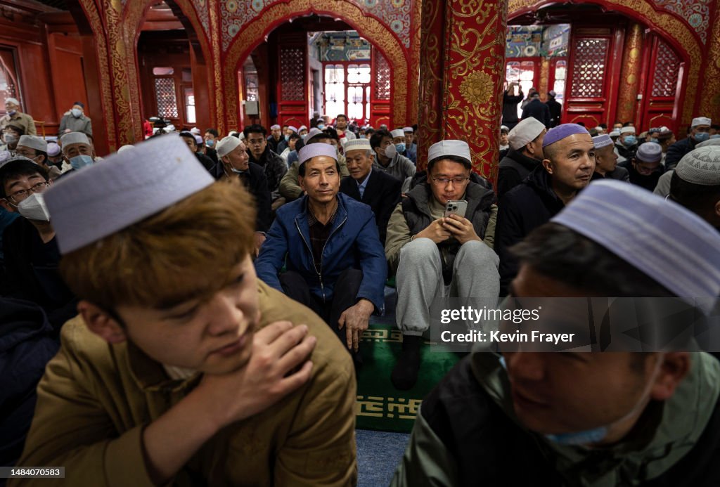 Chinese Musims Muslim men wait before performing Eid al-Fitr prayers at the historic ...