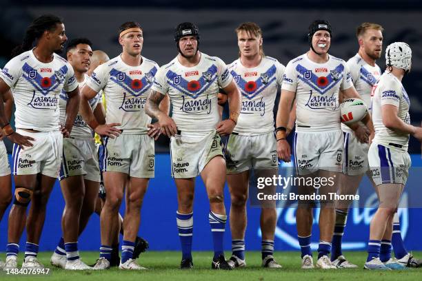 Bulldogs players react during the round eight NRL match between Canterbury Bulldogs and Cronulla Sharks at Accor Stadium on April 22, 2023 in Sydney,...