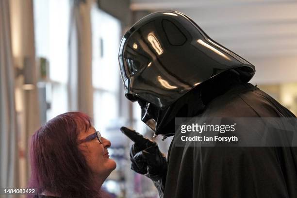 Character dressed as Darth Vader interacts with a visitor on the first day of the Scarborough Sci-Fi weekend on April 22, 2023 in Scarborough,...