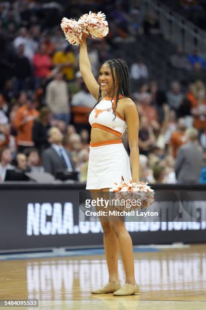 Texas Longhorns cheerleader on the floor during the Sweet 16 round of the NCAA Men's Basketball Tournament game against the Xavier Musketeers at...