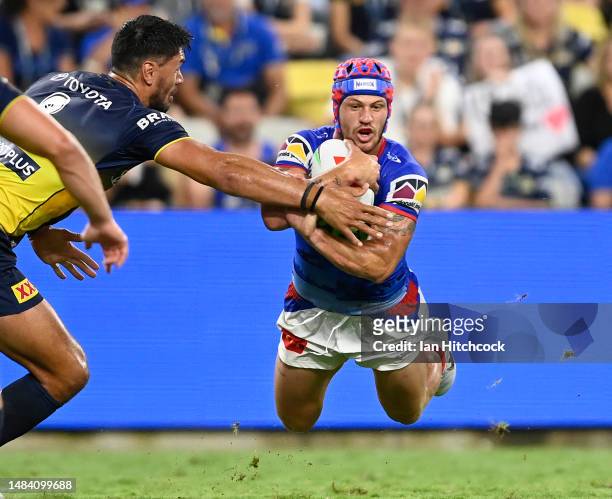 Kalyn Ponga of the Knights is tackled during the round eight NRL match between North Queensland Cowboys and Newcastle Knights at Qld Country Bank...
