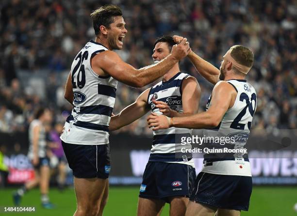 Tom Hawkins of the Cats is congratulated by team mates after kicking a goal during the round six AFL match between Geelong Cats and Sydney Swans at...
