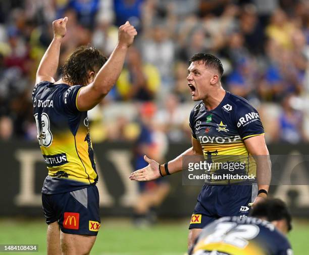 Scott Drinkwater and Reuben Cotter of the Cowboys celebrate after winning the round eight NRL match between North Queensland Cowboys and Newcastle...