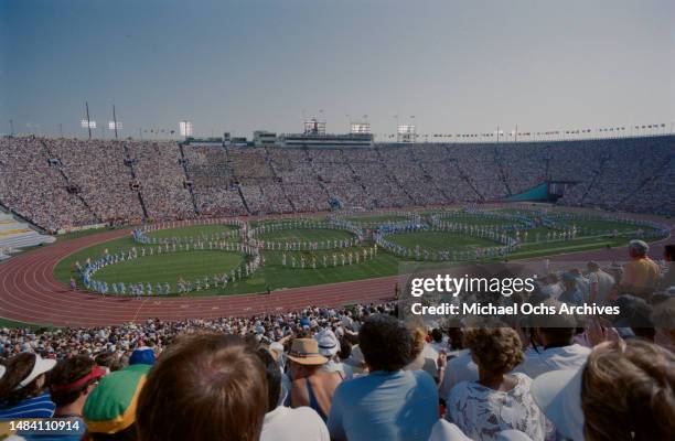High-angle view showing performers making the shape of the Olympic Rings during the opening ceremony of the 1984 Summer Olympics, as seen from the...