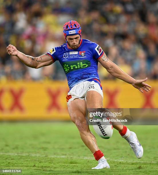 Kalyn Ponga of the Knights kicks the ball during the round eight NRL match between North Queensland Cowboys and Newcastle Knights at Qld Country Bank...