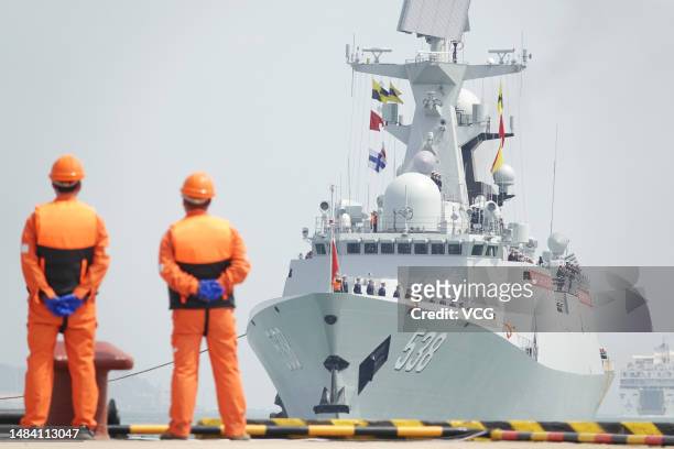 The guided-missile frigate Yantai arrives at Yantai Port during a celebration activity to celebrate the 74th anniversary of the founding of the...