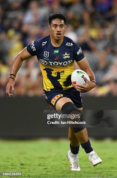 Murray Taulagi of the Cowboys runs the ball during the round eight NRL match between North Queensland Cowboys and Newcastle Knights at Qld Country...