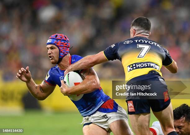 Kalyn Ponga of the Knights is tackled during the round eight NRL match between North Queensland Cowboys and Newcastle Knights at Qld Country Bank...