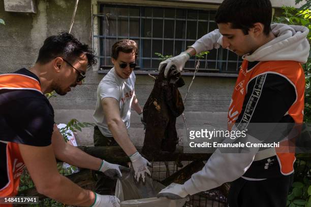 Volunteers take part in a clean up event held by association WAU! to clean the streets and the public spaces of Certosa district on the occasion of...
