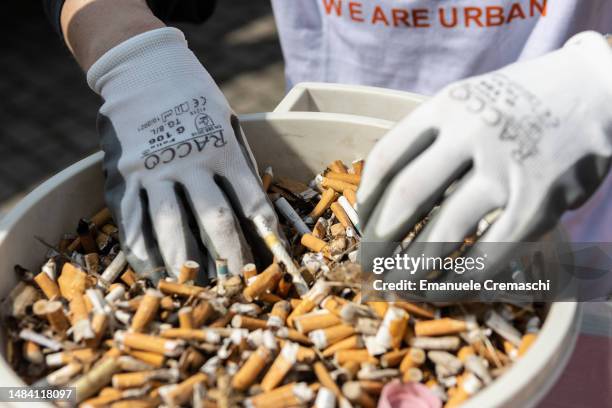 Volunteers take part in a clean up event held by association WAU! to clean the streets and the public spaces of Certosa district on the occasion of...