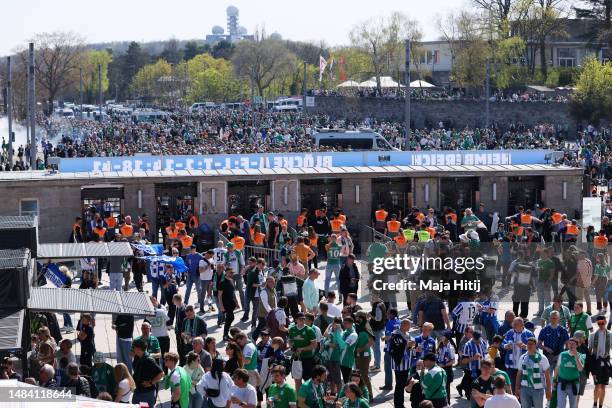 Fans arrive at the stadium prior to the Bundesliga match between Hertha BSC and SV Werder Bremen at Olympiastadion on April 22, 2023 in Berlin,...