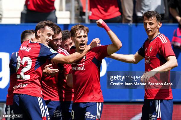 Jon Moncayola of CA Osasuna celebrates with teammates after scoring the team's third goal during the LaLiga Santander match between CA Osasuna and...