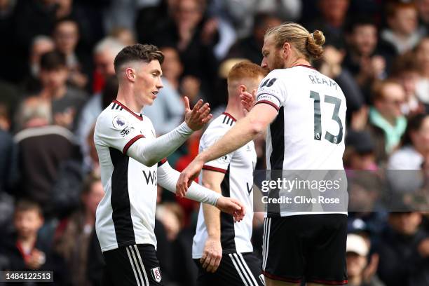 Harry Wilson of Fulham celebrates with teammate Tim Ream after scoring the team's first goal during the Premier League match between Fulham FC and...