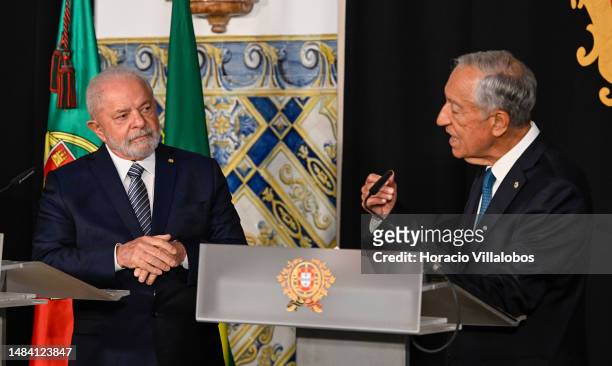 The President of Brazil Luiz Inácio Lula da Silva listens to Portuguese President Marcelo Rebelo de Sousa delivering remarks during the joint press...