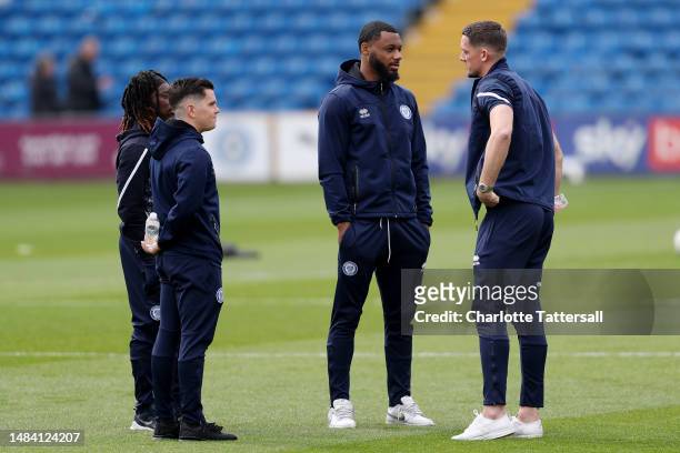 Sam Graham and team mates of Rochdale inspect the pitch prior to the Sky Bet League Two between Stockport County and Rochdale at Edgeley Park on...