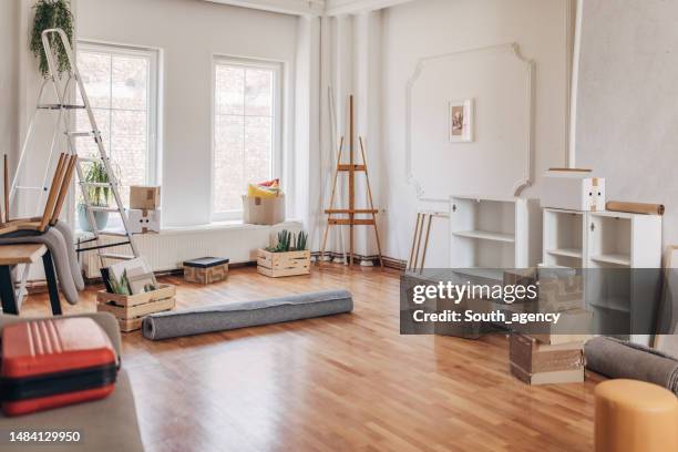 messy living room in new apartment - messy apartment stock pictures, royalty-free photos & images