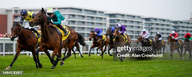 Rob Hornby riding Remarquee win The Dubai Duty Free Stakes at Newbury Racecourse on April 22, 2023 in Newbury, England.