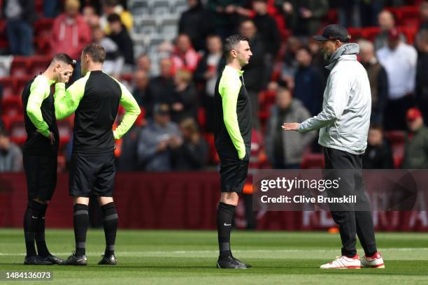 Juergen Klopp, Manager of Liverpool, speaks to referee, Michael Oliver, prior to the Premier League match between Liverpool FC and Nottingham Forest...