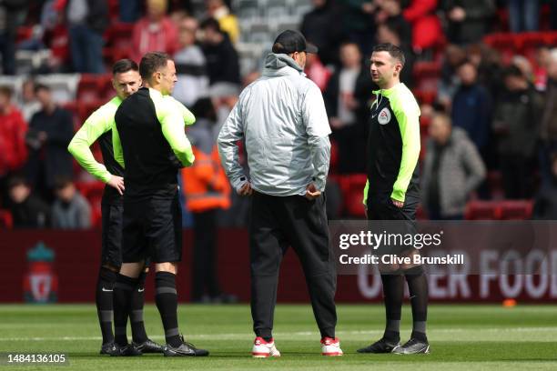 Juergen Klopp, Manager of Liverpool, speaks to referee, Michael Oliver, prior to the Premier League match between Liverpool FC and Nottingham Forest...