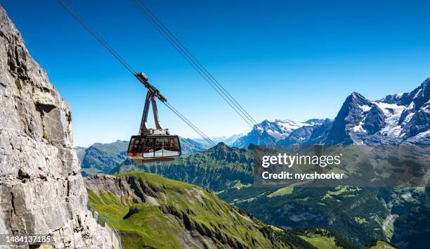 switzerland travel - overhead cable car from murren to schilthorn - lauterbrunnen stock pictures, royalty-free photos & images