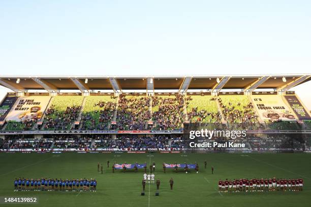 Players line up for a pre-game ANZAC ceremony during the round nine Super Rugby Pacific match between Western Force and Highlanders at HBF Park, on...