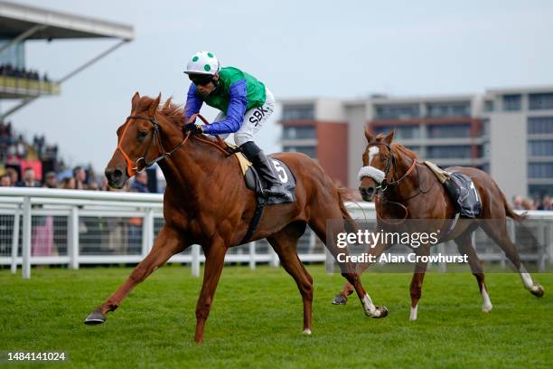 Sean Levey riding Issac Shelby win The Watership Down Stud Too Darn Hot Greenham Stakes with the riderless Chaldean behind after Frankie Dettori was...