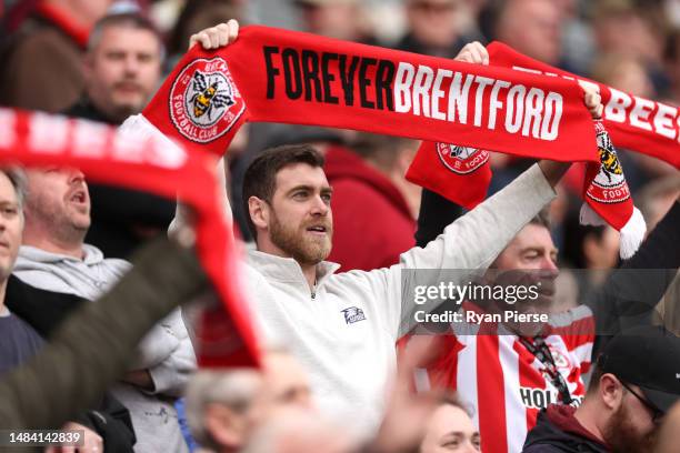 Brentford fan shows their support from the stands prior to the Premier League match between Brentford FC and Aston Villa at Brentford Community...