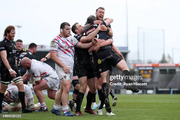 Ian Whitten of Exeter Chiefs celebrates scoring the team's first try with teammates Stuart Hogg and Tom Wyatt during the Gallagher Premiership Rugby...