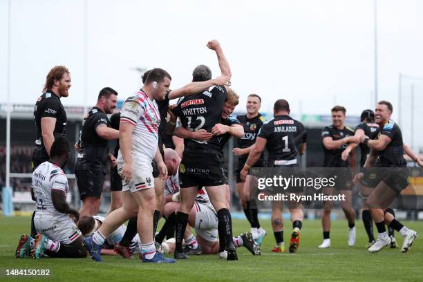 Ian Whitten of Exeter Chiefs celebrates scoring the team's first try with teammates during the Gallagher Premiership Rugby match between Exeter...