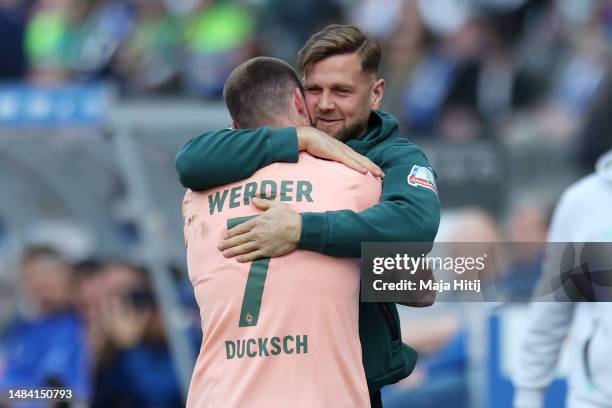 Marvin Ducksch of SV Werder Bremen celebrates with teammate Niclas Fuellkrug after scoring the team's third goal during the Bundesliga match between...