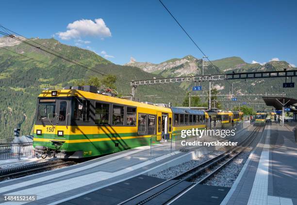 switzerland travel - wengen railroad station in the jungfrau region of switzerland - jungfraujoch stockfoto's en -beelden