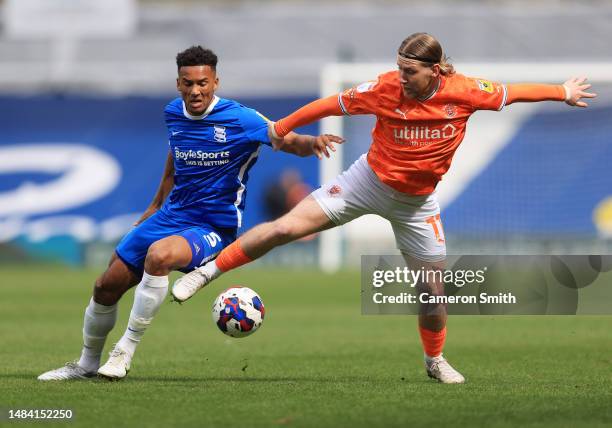 Josh Bowler of Blackpool is challenged by Auston Trusty of Birmingham City during the Sky Bet Championship between Birmingham City and Blackpool at...